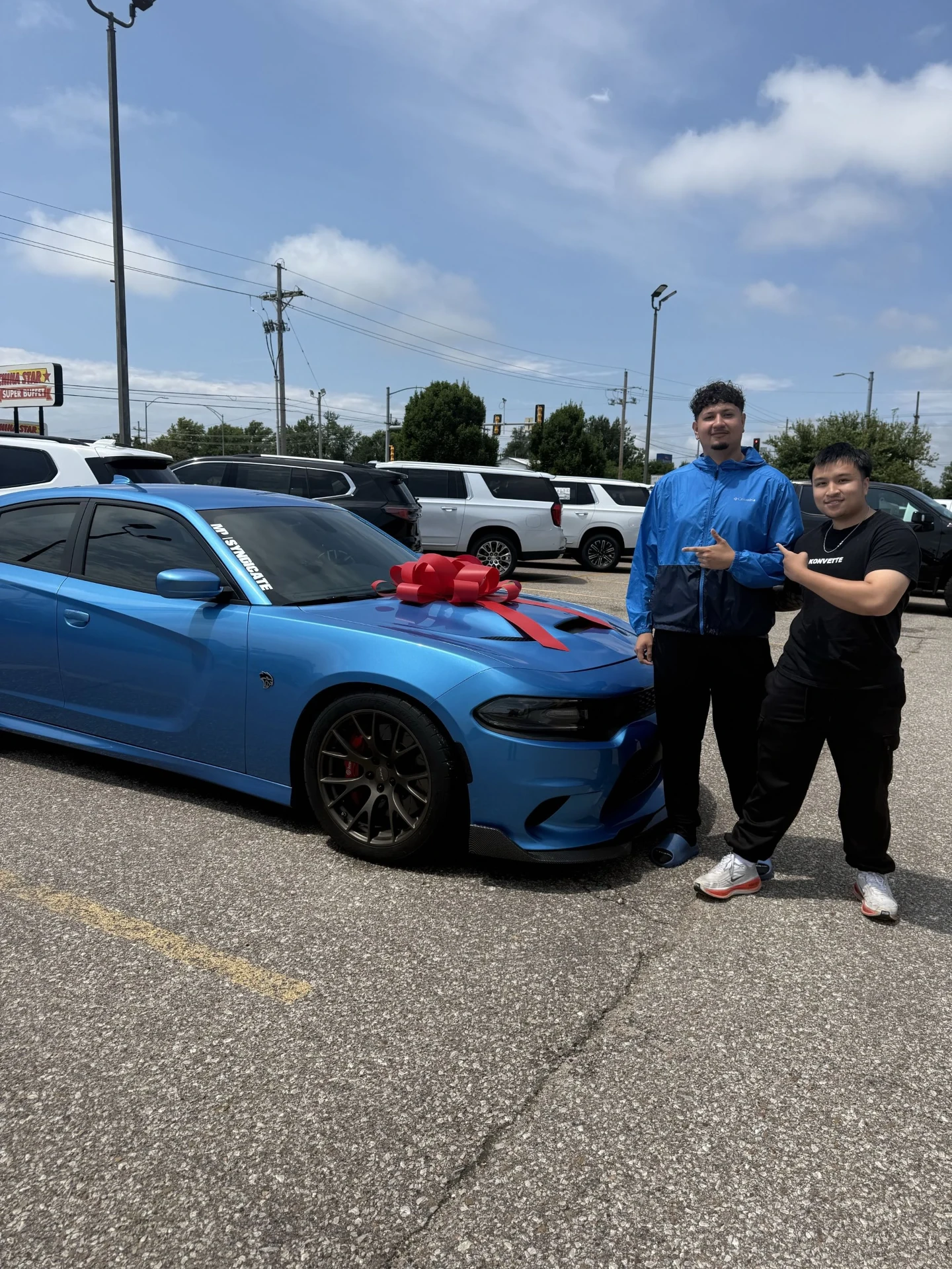 EcomOptimized student with his new Charger Hellcat